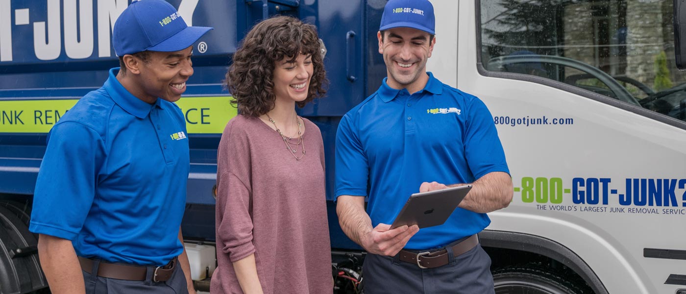 1800-GOT-JUNK? team with a junk removal customer