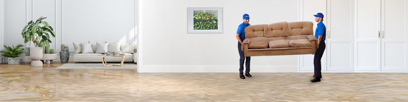 1800-GOT-JUNK? Truck Team Members hauling away a couch