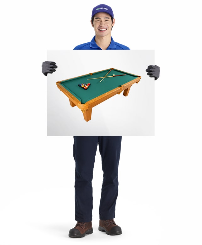Pool Table for removal and disposal by 1-800-GOT-JUNK? truck team member